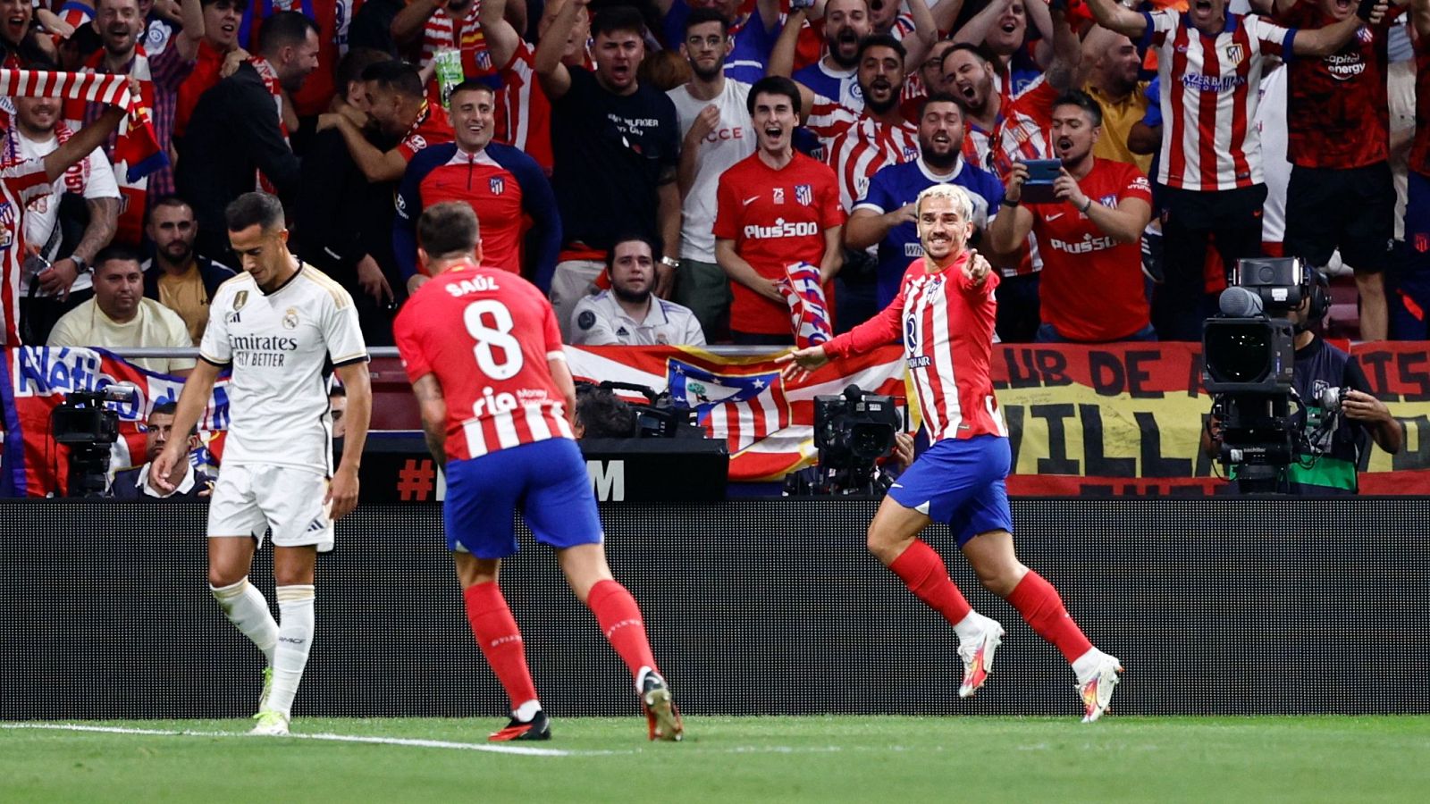 Atlético Madrid players celebrate during a league derby against Real Madrid at the Metropolitano